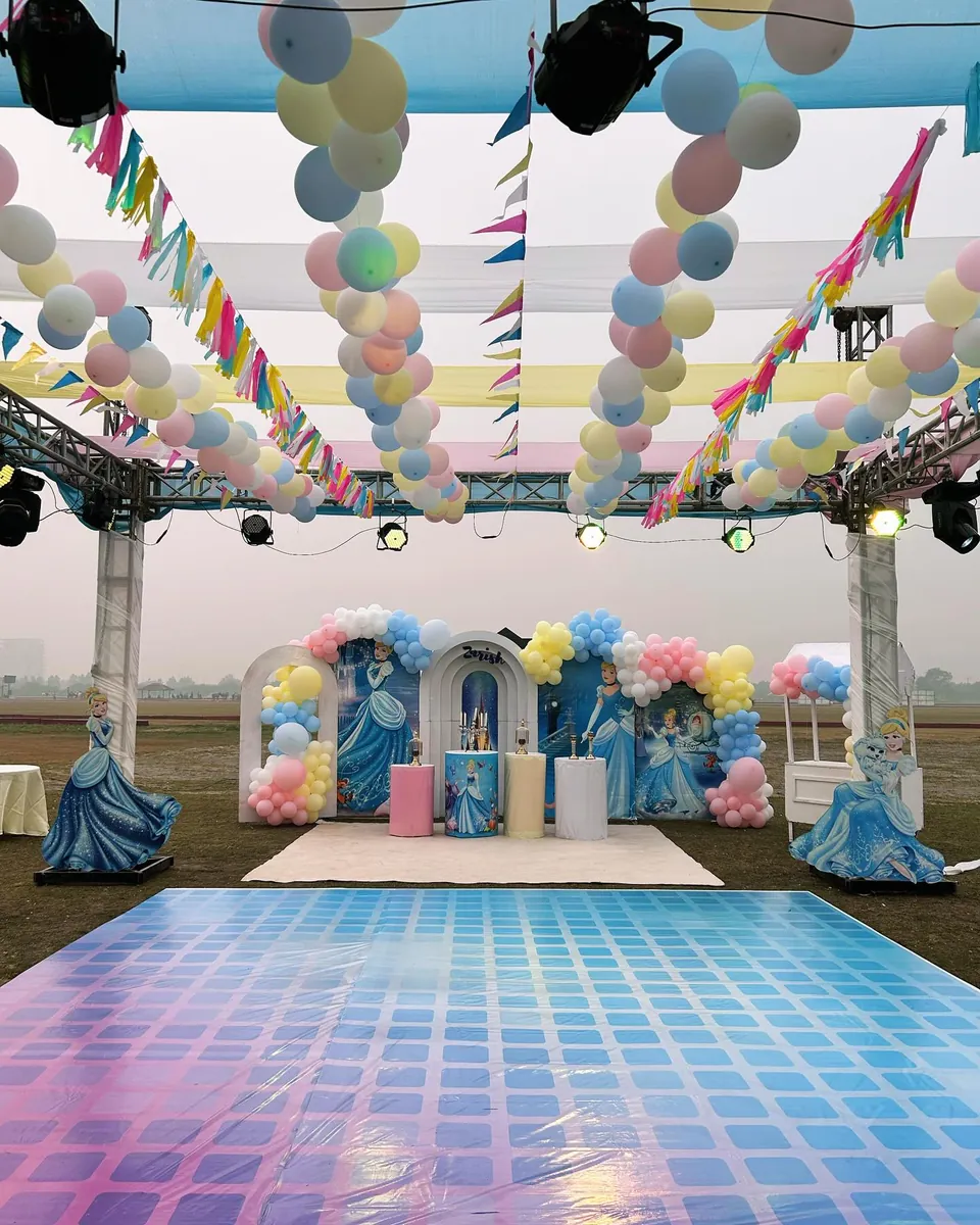 Princess-themed children's party with pastel balloons, character cut-outs and a glossy dance floor — Baraka Events, Lahore