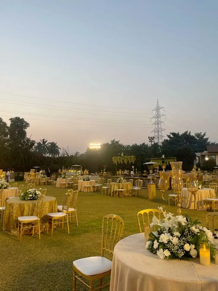 Real outdoor farmhouse wedding setup with evening lighting, produced by Baraka Events in Lahore